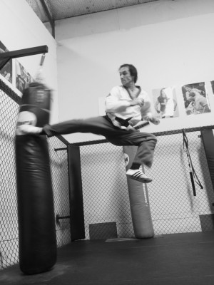 Justin Warren excecutes a jump back kick at 43 years of age - B & W