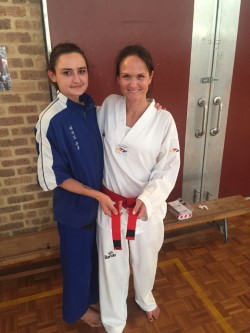 Ajana Plunkett (Head Instructor with Melanie Buhlman after grading for Probationary Black Belt. - www.tkdcentral.com