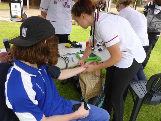 Instructor John Crawford is Health Checked By Nurse Nicola Engels - ECU Wellness Day - www.tkdcentral.com