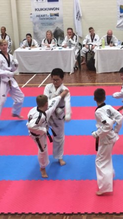 Deacon Malatesta lands his kick at the Black belt Grading - www.tkdcentral.com