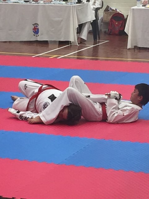 Kian Stapleton Locks A Side Arm Bar On His Partner At Black Belt Grading - www.tkdcentral.com