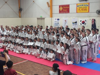 New Blackbelts Getting Teir Photo - www.tkdcentral.com