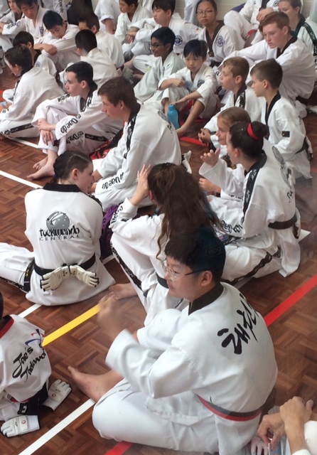 Our Black Belts Wait To Be Called At The Black Belt Grading - www.tkdcentral.com