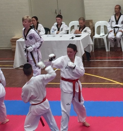 Rachel Atkinson Sparring During Grading - www.tkdcentral.com