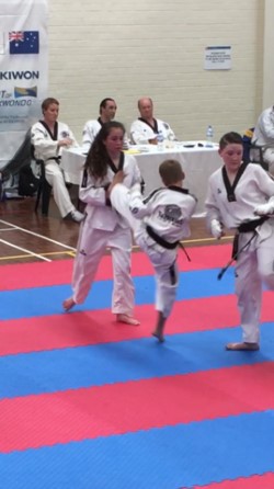 Tahlia Gowland & Deacon malatesta spar during black belt grading - www.tkdcentral.com