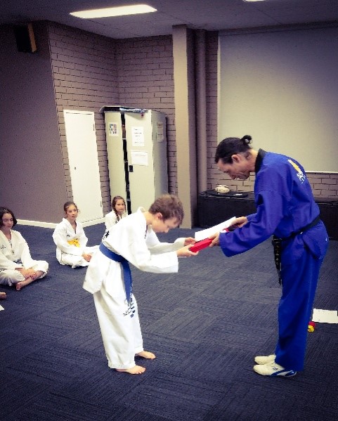 Deagan McDonald passes his Red Belt - www.tkdcentral.com