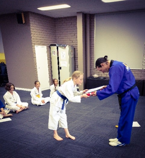 Narelle Pollard passes her red belt - www.tkdcentral.com