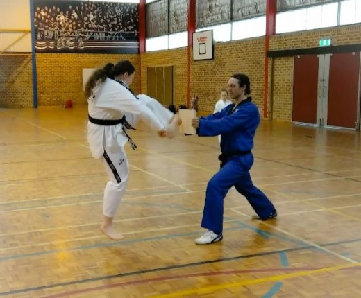 Rebecca Collis Launches A Push front Kick At The Board which smashes with ease - www.tkdcentral.com