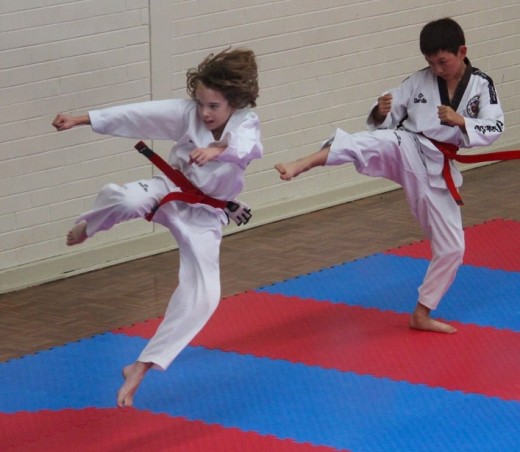 Lucas Hitchens Launches A Tornado Kick During His Black Belt Grading - www.tkdcentral.com