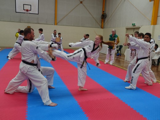 Trinity Best Smashes Her Boards On Her Way To 2nd Dan Black belt - www.tkdcentral.com